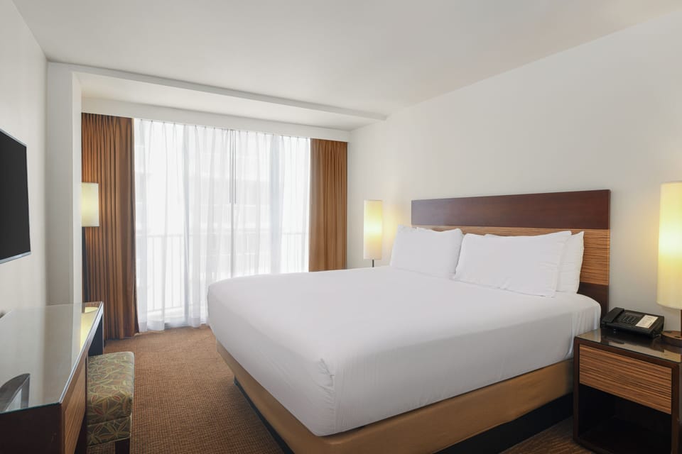 Unwind in a serene room with soft light and comfort.