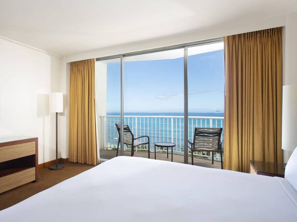 Drift off to waves beyond your private balcony seating.