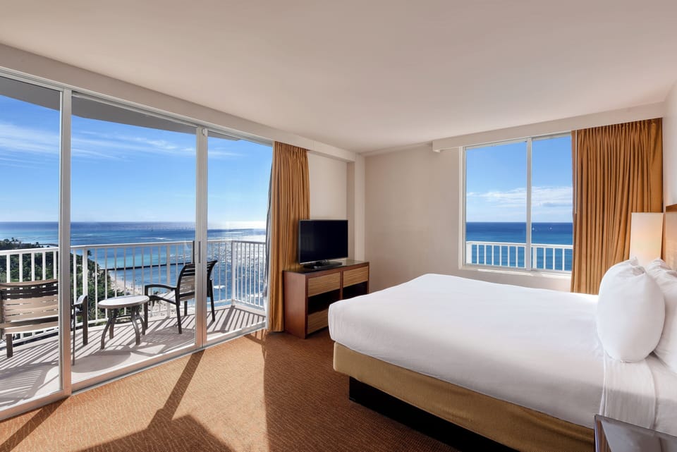Lounge in bright comfort with corner windows and ocean vistas.