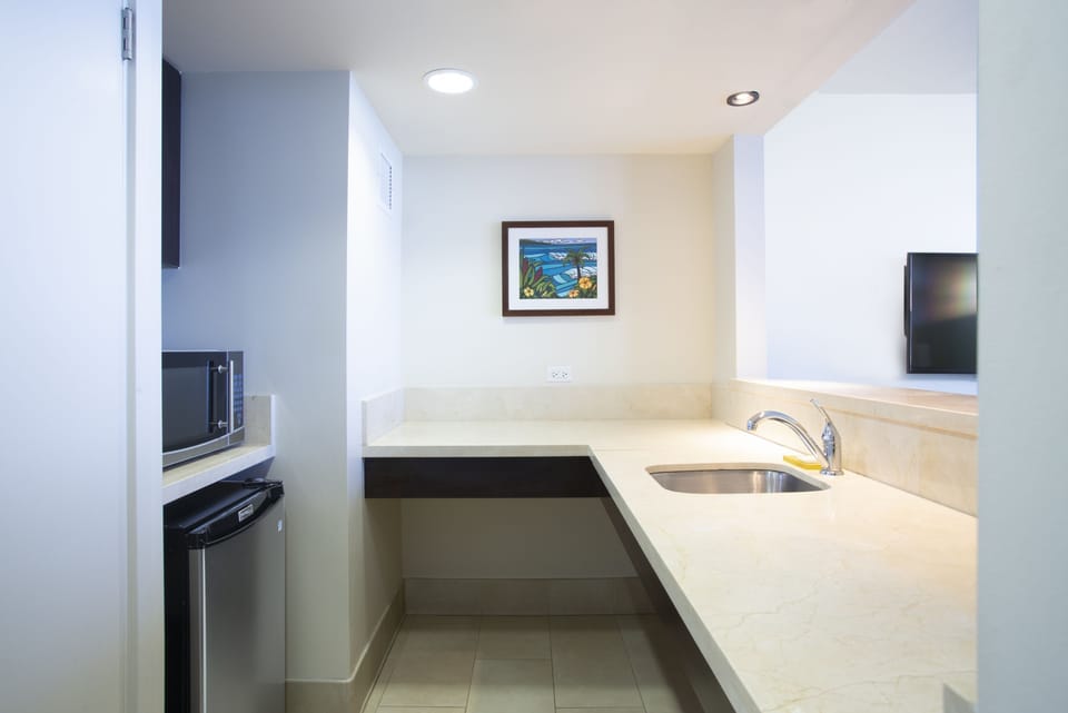 Prep quick snacks at the bright kitchenette between adventures.
