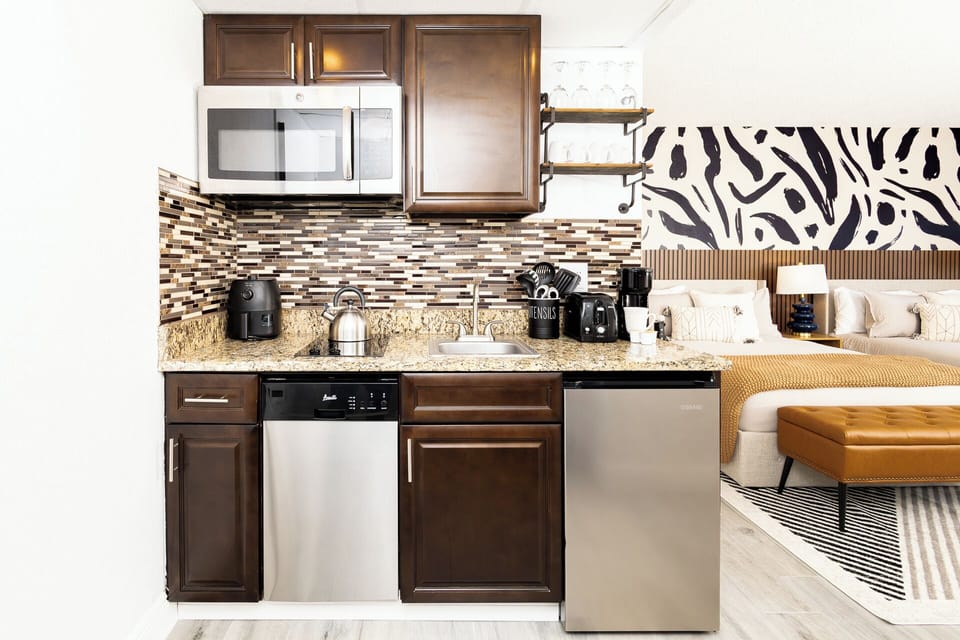 
Full kitchen with freezer, stove, microwave, coffee maker, toaster, dishwasher
