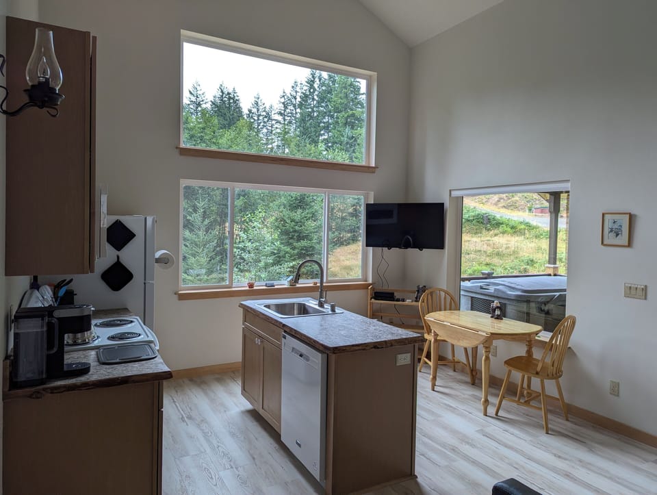 Island, dishwasher, dinette, & entertainment center