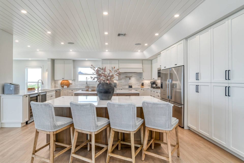 The second kitchen island is the perfect place to chat with your group and the stylish stools provide four additional seats.