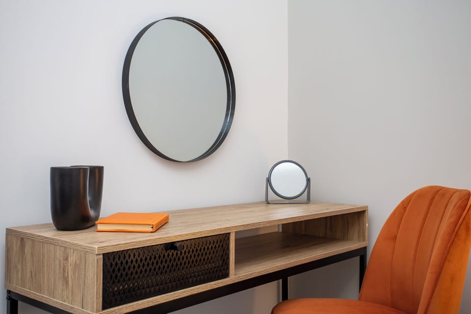 Additionally, a reading table and chair create a cozy corner for work or leisure, making this bedroom a peaceful retreat after a day of exploring South Shields.