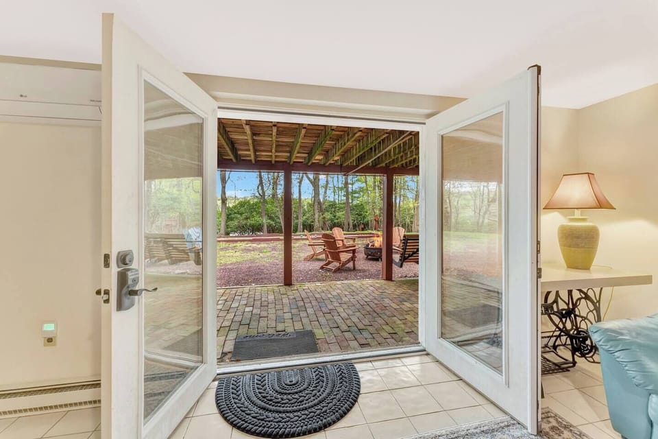 Backyard Oasis: Step outside to a serene patio with lounge chairs and a fire pit, perfect for gatherings!