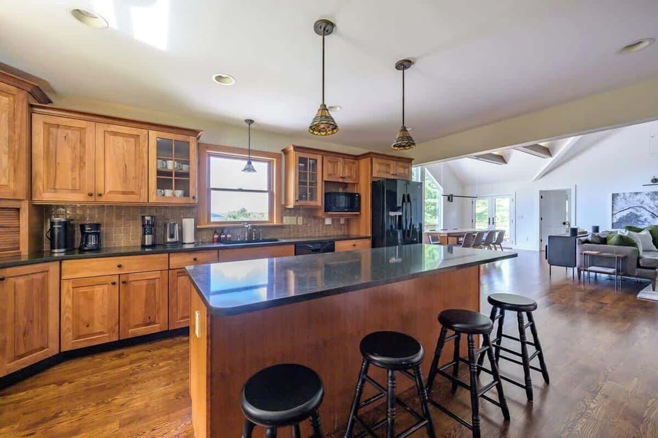 Eat-in kitchen is open to the high-ceilinged living room