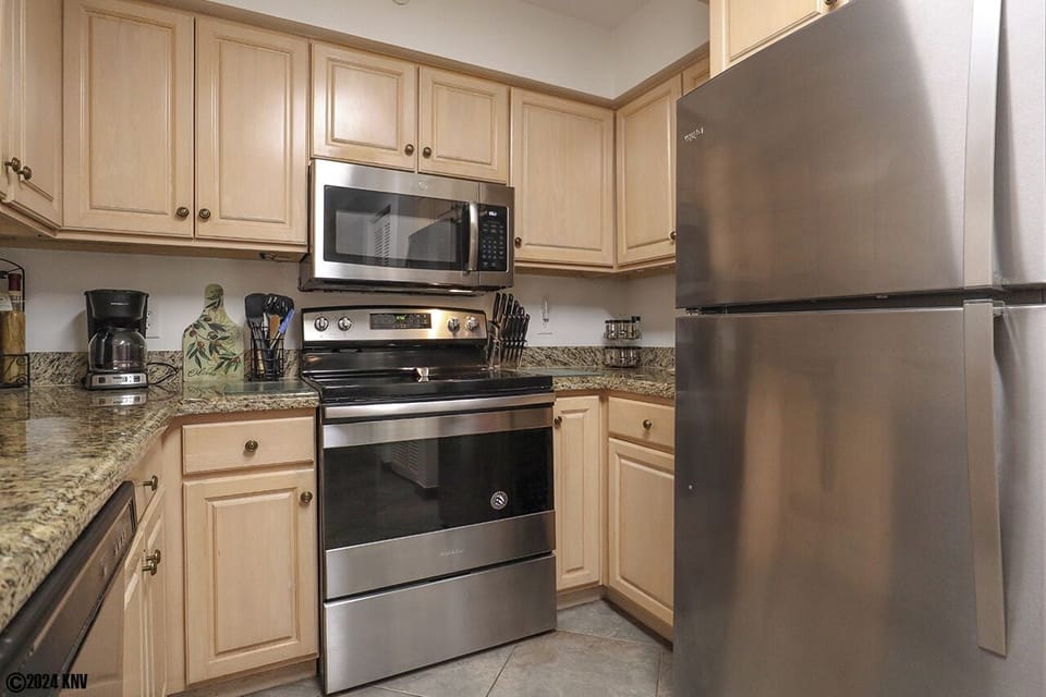 Newly remodeled Kitchen has beautiful cabinetry, new appliances and granite countertops.