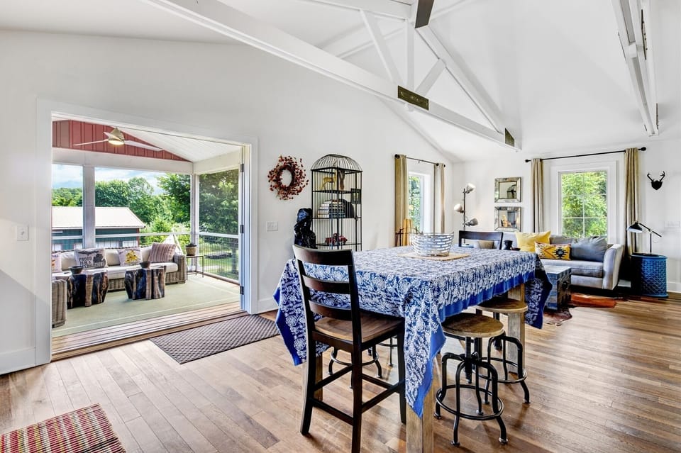 Kitchen area opens to the screen porch through the large French doors