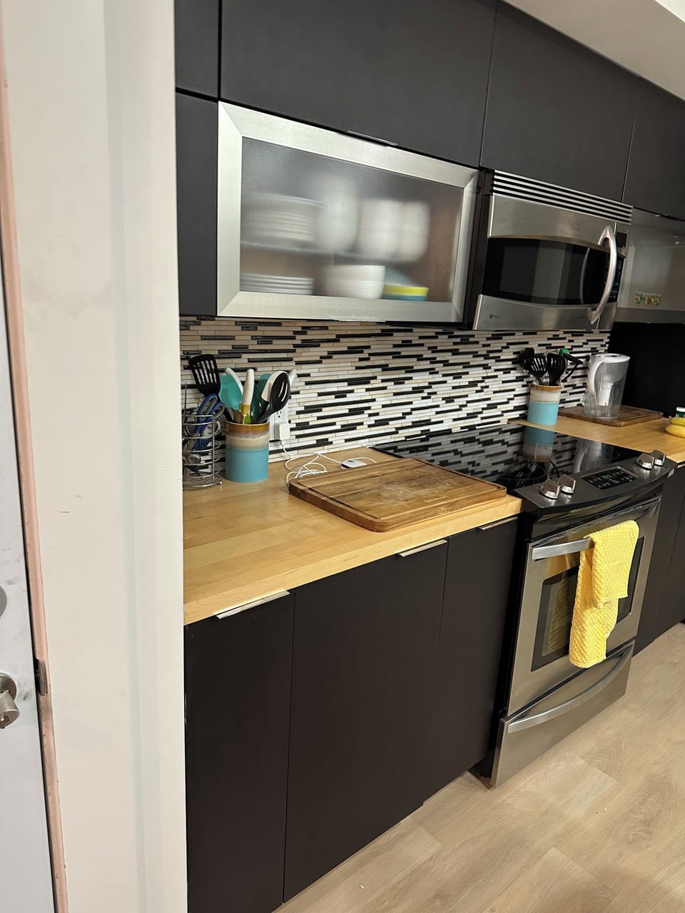 Kitchen cabinets, microwave stove and fridge