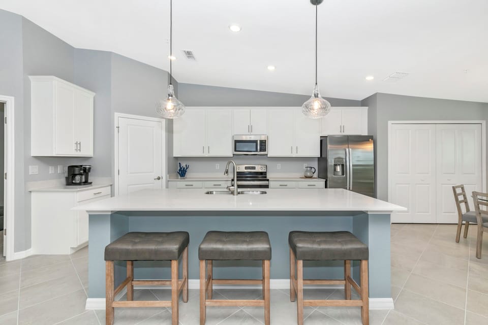 Large kitchen island and two pantries for plenty of storage