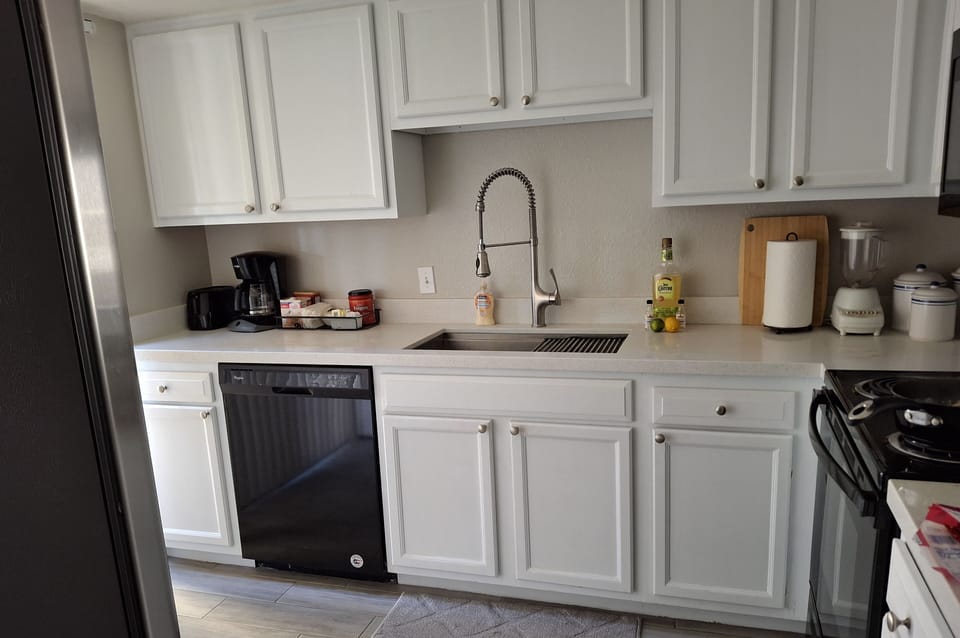fully stocked kitchen.  Fridge with  ice maker, stove, microwave and dishwasher.