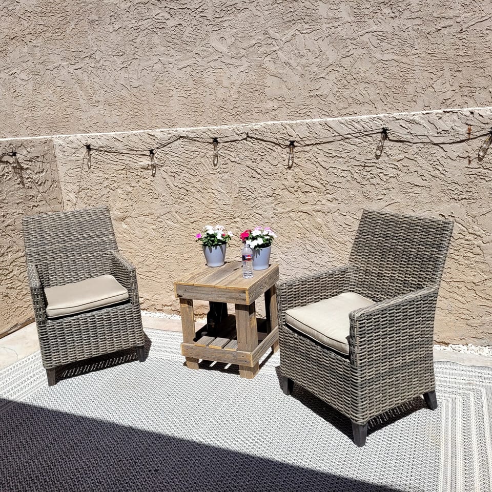 solar lighted patio  with furniture  and grill 