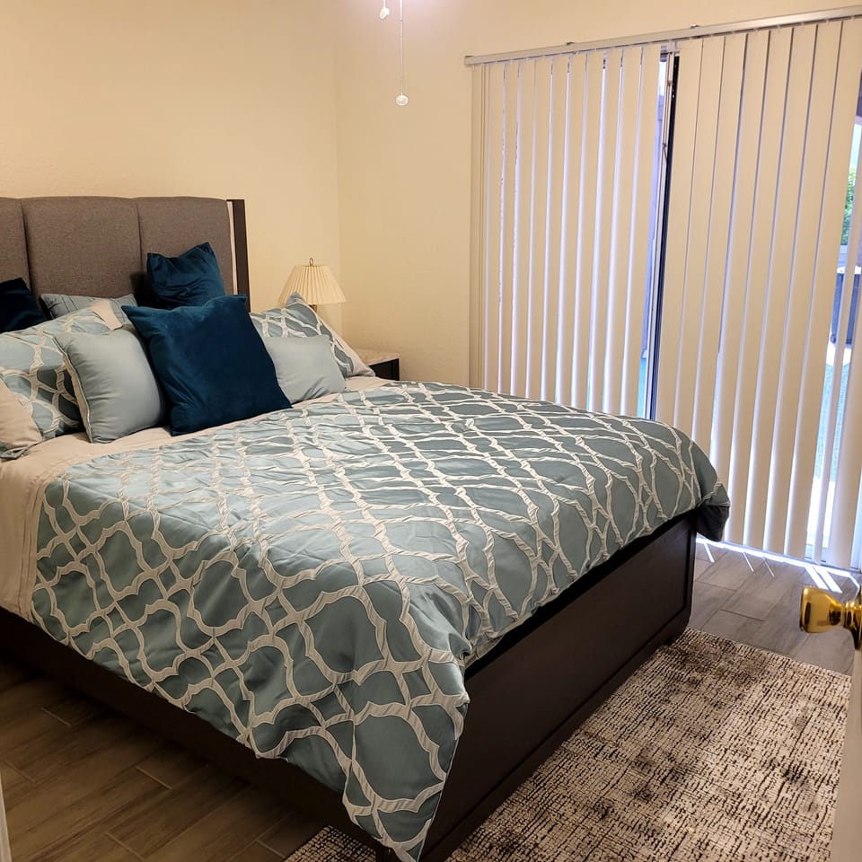 second  bedroom  with ceiling  fan and large xloset