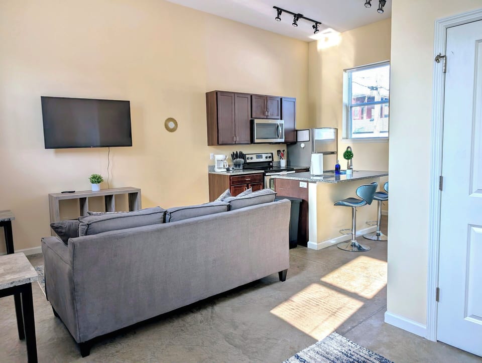 The cozy living room is designed for relaxation and entertainment.
