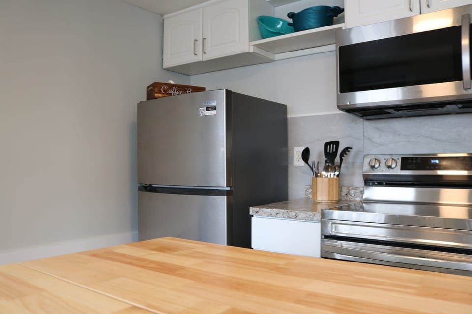 a fully stocked kitchen awaits complete with an island with seating for 2 and all the essentials.