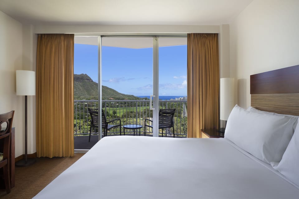 Breathe in mountain-to-sea views from your serene bedroom.