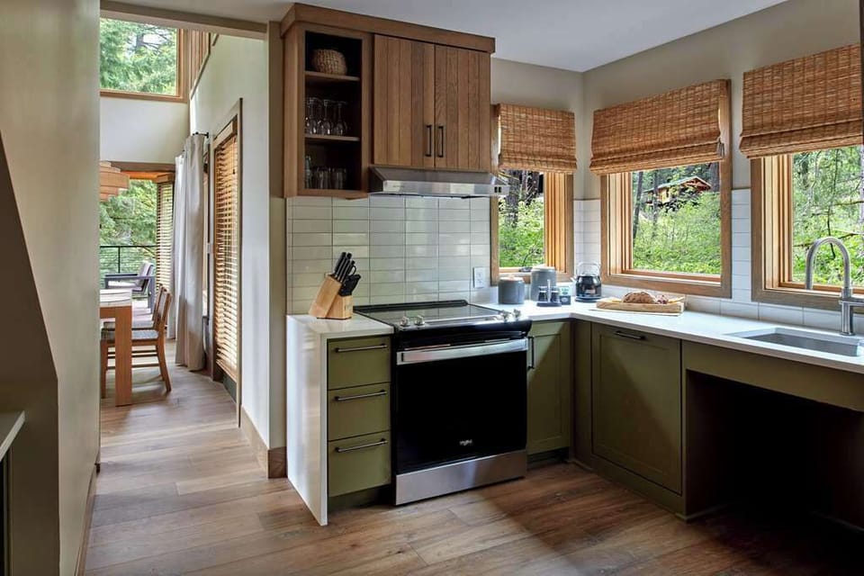 Fully equipped kitchen with modern appliances and scenic views, perfect for culinary adventures.