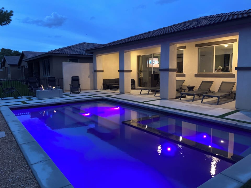 Relaxing Pool has a shallow zone and spa. Firepit area by pool and BBQ nearby.