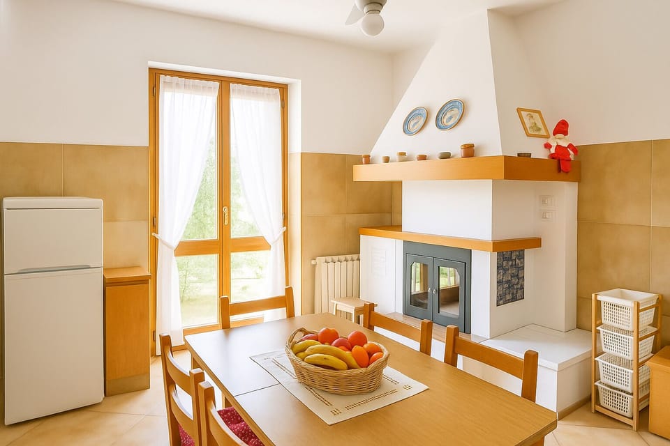 Kitchen with fireplace and French door to access garden