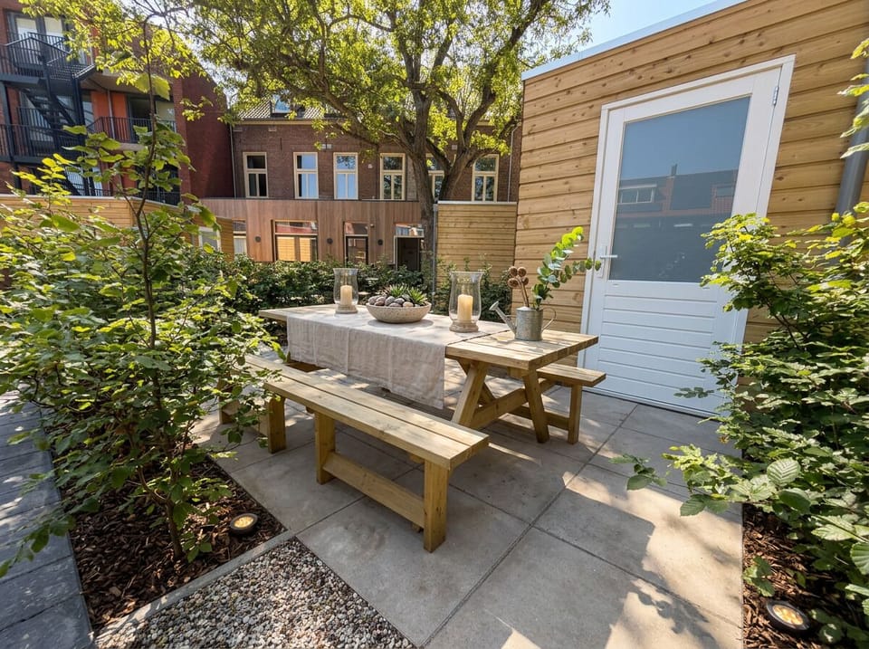 Private garden terrace with outdoor dining area, comfortable seating, and a peaceful setting to relax and enjoy the fresh air.