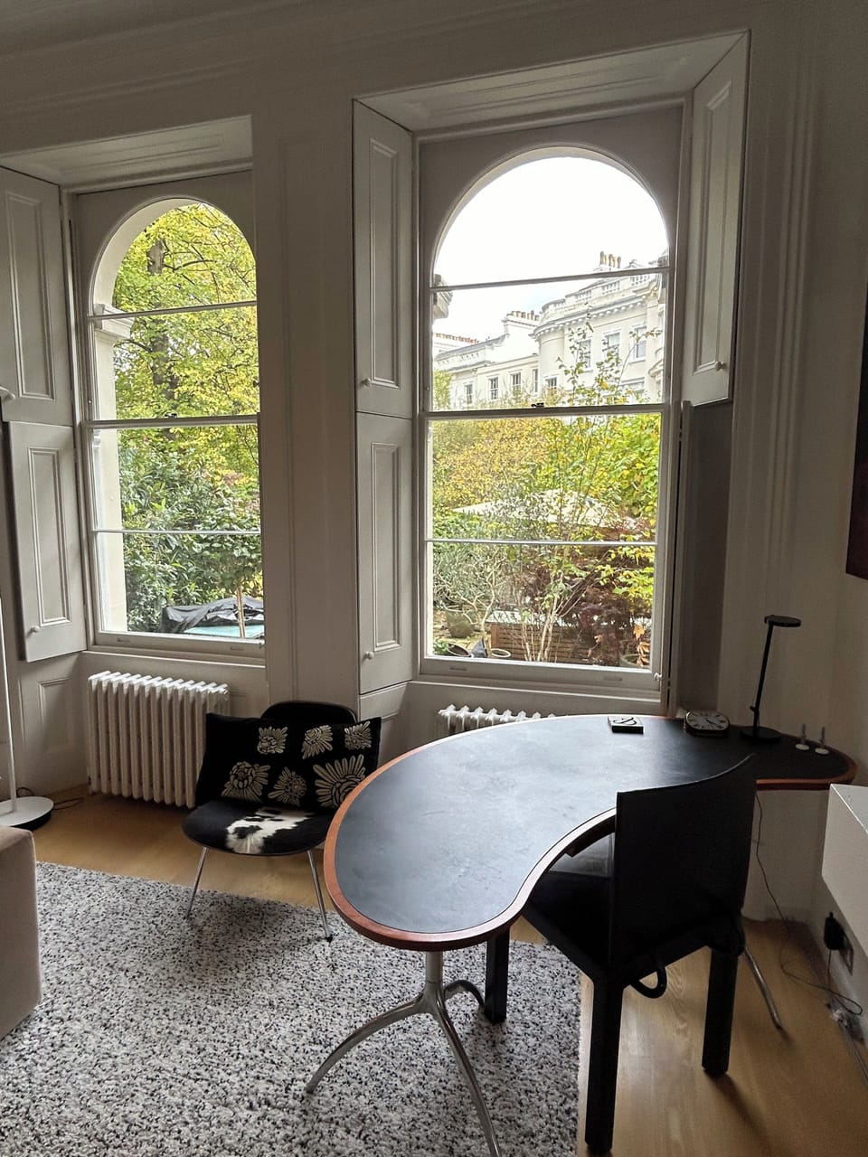 Desk in sitting room with garden view