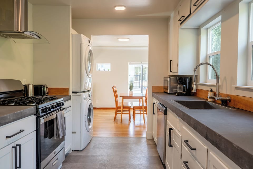 Fully stocked kitchen - view to dining area