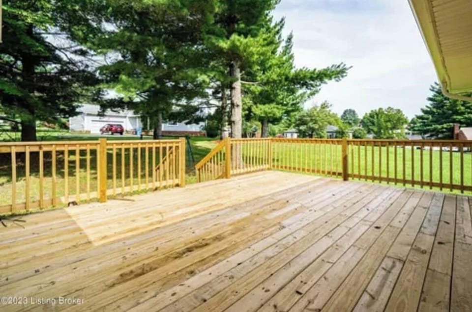 Back deck with grill and chairs
