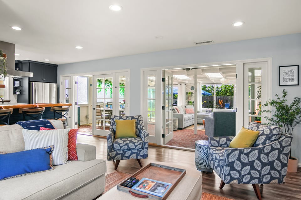 Double Santa Barbara doors and windows welcome you to the Sunroom, a guest fave!