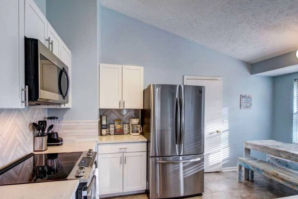 Open-concept kitchen seamlessly blending into the living room, for entertaining and family gatherings.