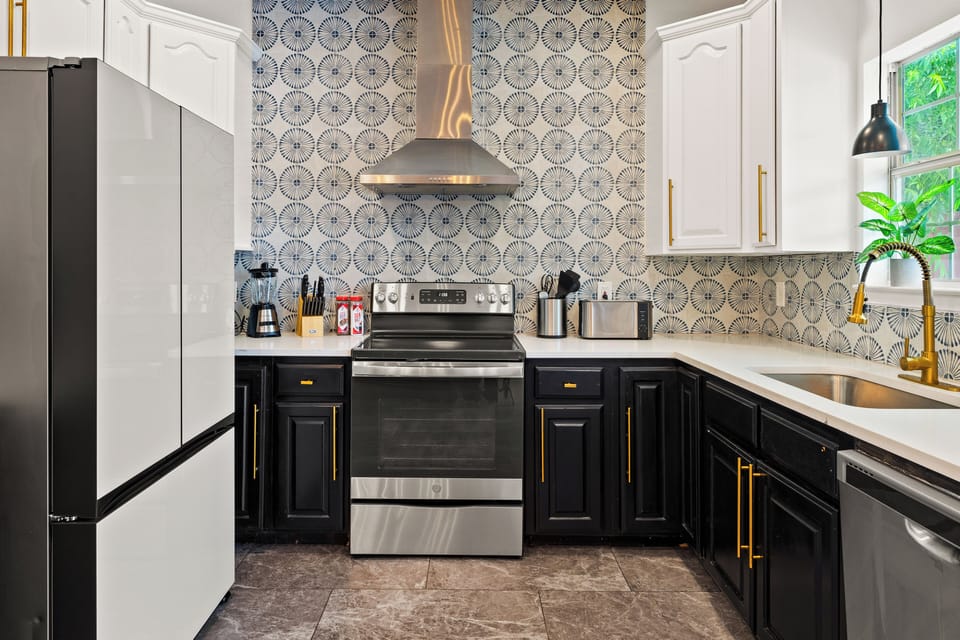 Full Kitchen with Bespoked Fridge and Stainless Steel Appliances