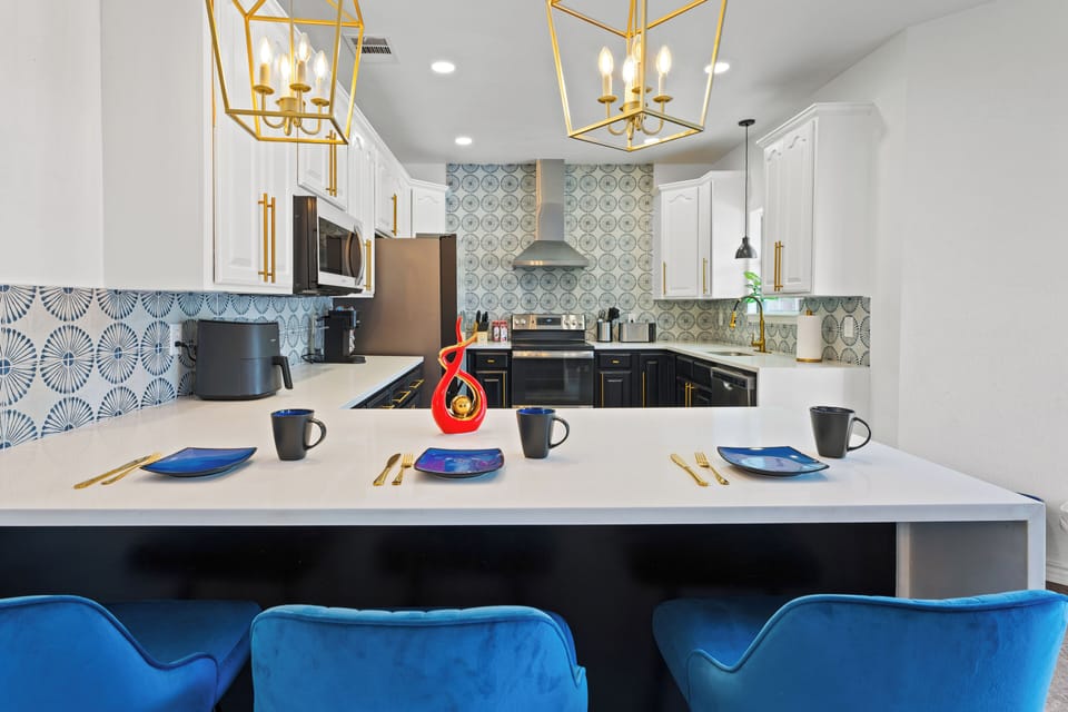 Full Kitchen with Bespoked Fridge and Stainless Steel Appliances