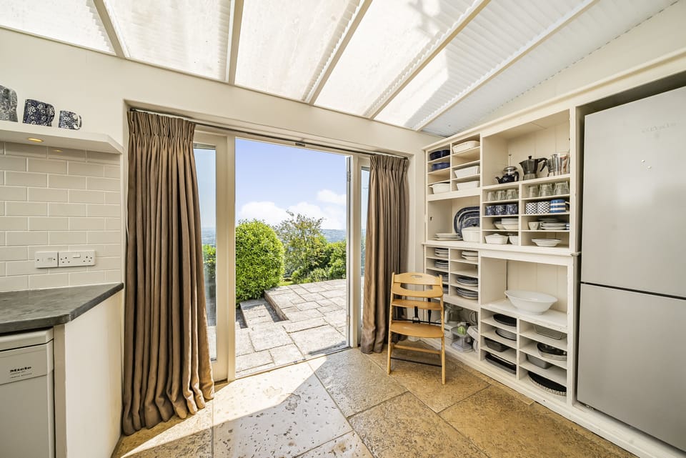 Nash Cottage, Marshwood, Bridport: Step out on to the large layered patio from the kitchen