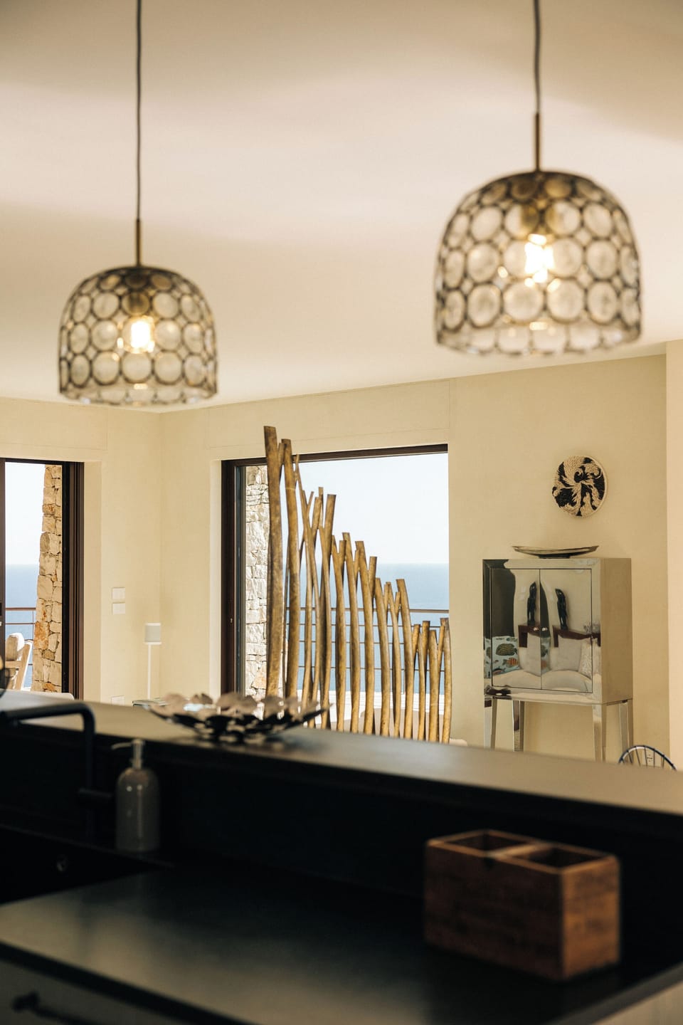Airy kitchen, seamlessly connected to the living room with a stunning view.