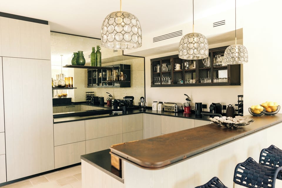 Fully equipped kitchen featuring an antique mirror that adds charm to the space.