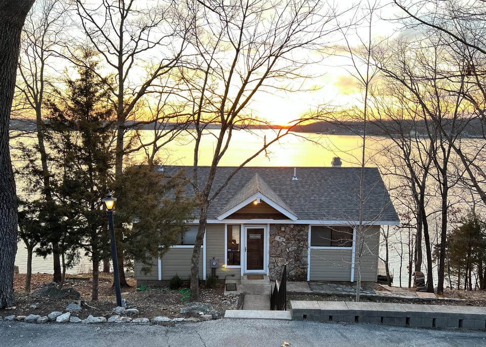 Large home with huge deck and private dock. 