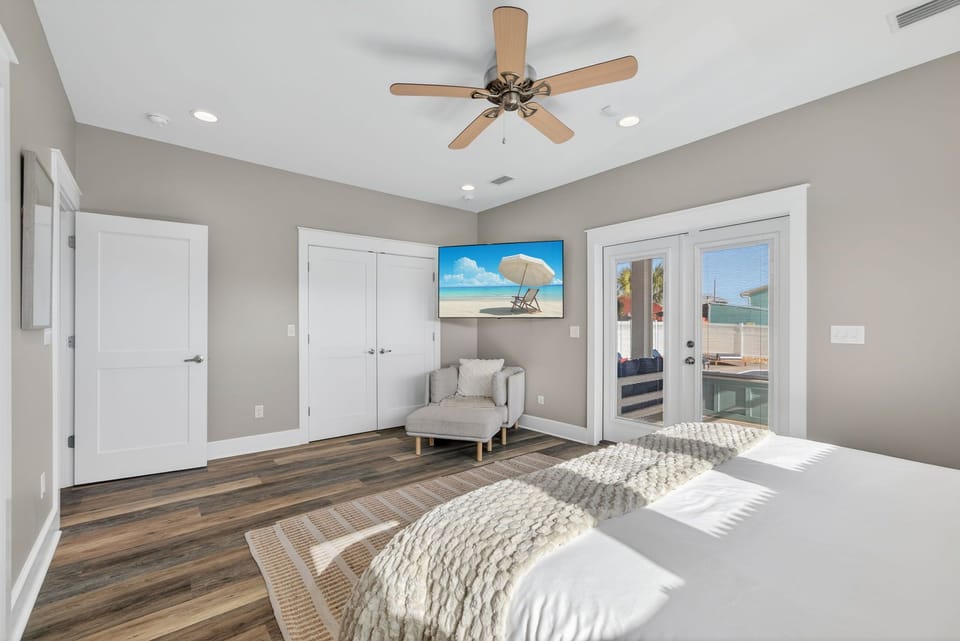 The primary suite overlooks the pool