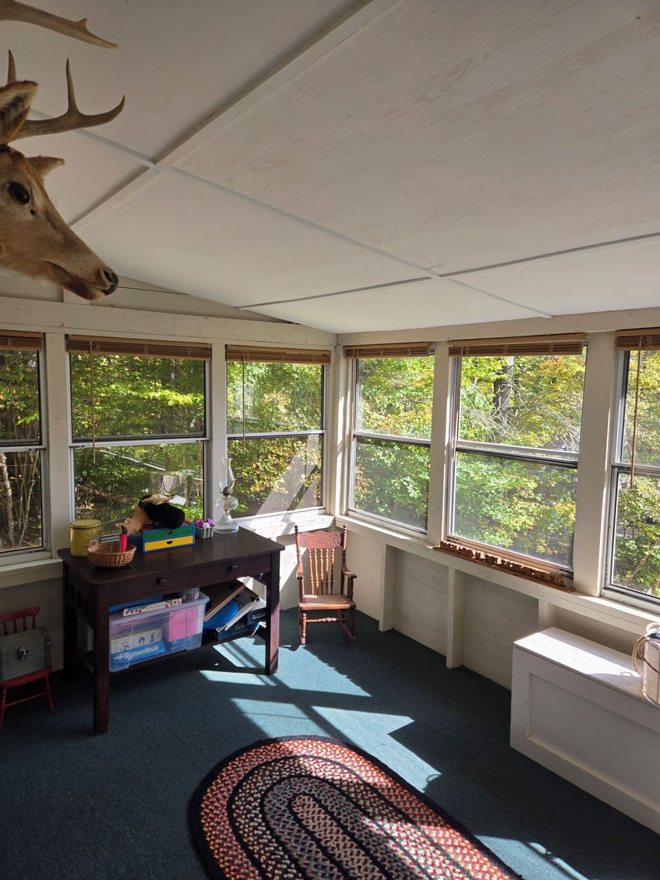 Screened porch with seating, games, dining area