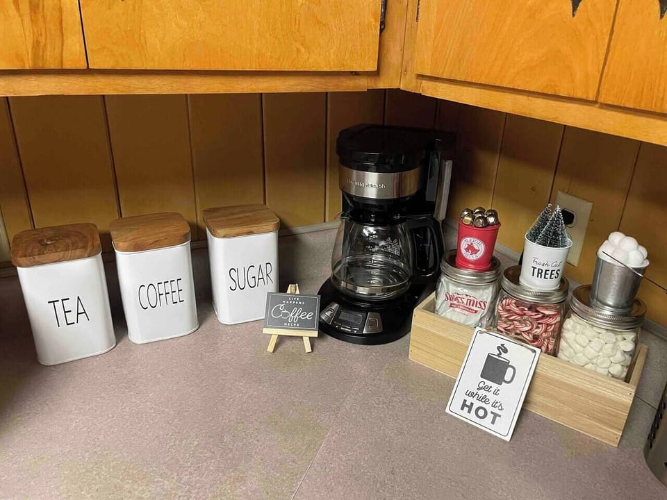 Kitchen - drip coffee machine, complimentary grounded coffee, and tea bags