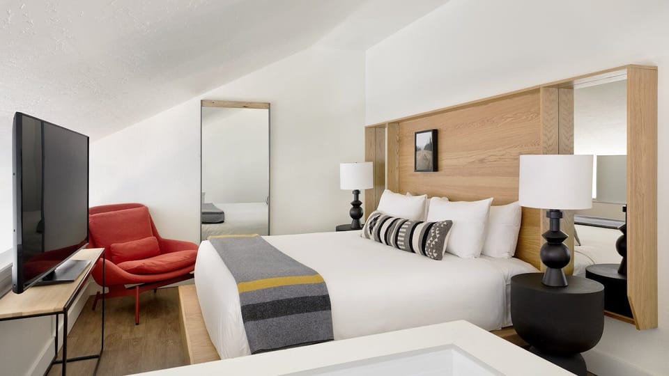 Unwind with lounge seating and a roomy, bright bedroom layout.