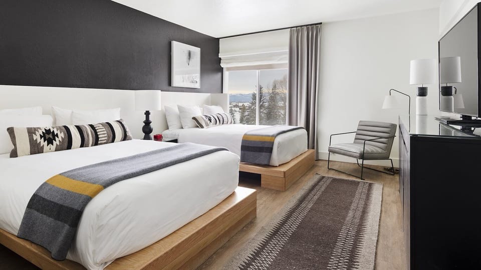 Spread out comfortably with two beds and calming, mountain-inspired decor.