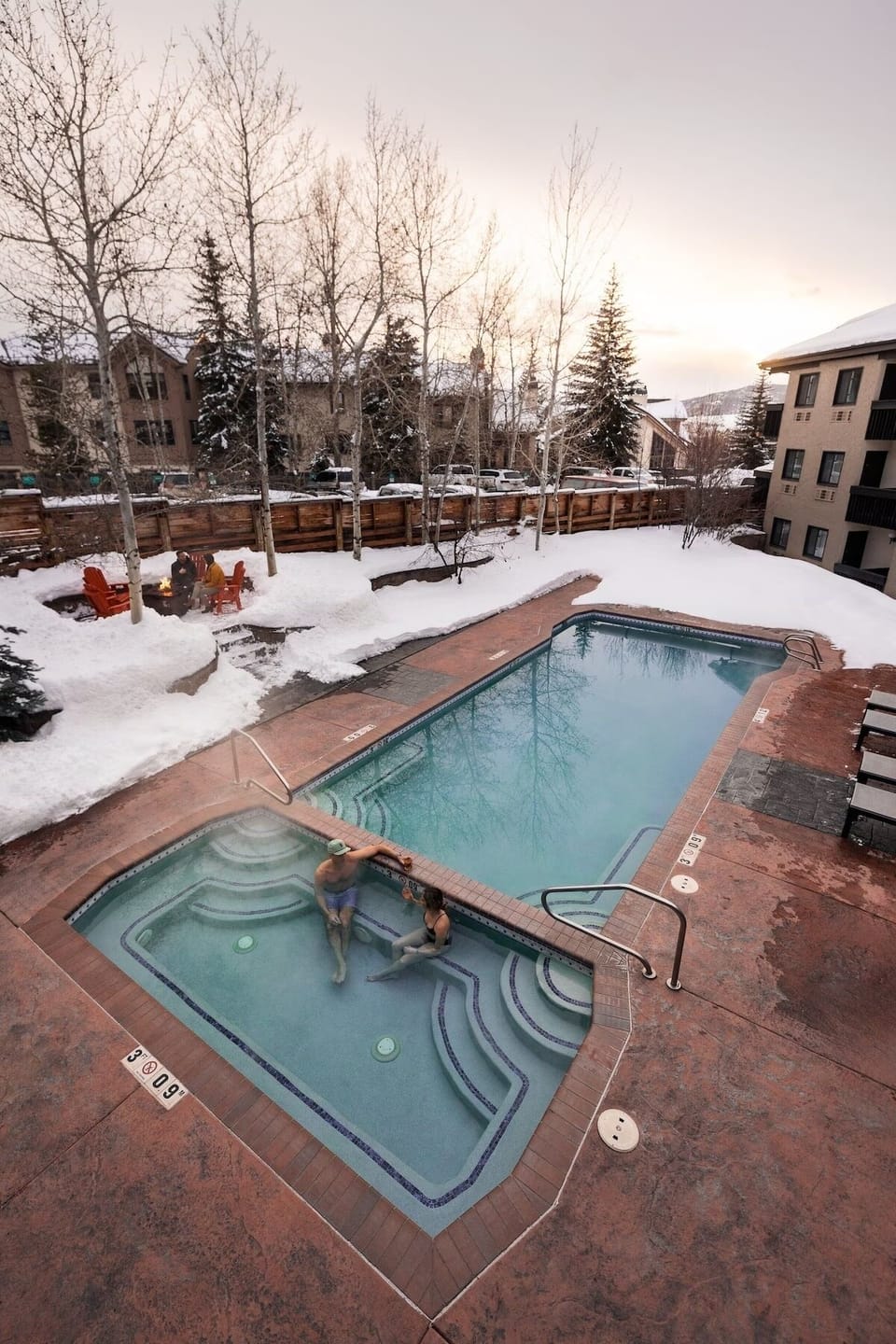 Soak in the heated pool and hot tub with snowy views.