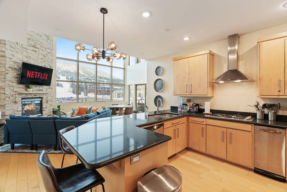 Whip up meals in this fully-equipped kitchen with a cozy breakfast table, just steps away from the living room! | The Juniper, Brian Head, Utah | Voyax Luxury Vacation Rentals
