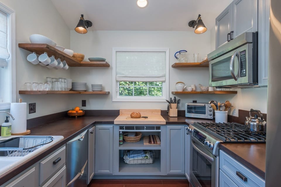 Custom kitchen featuring sleek cabinetry, stone countertops, and stainless appliances—perfect for whipping up gourmet meals.