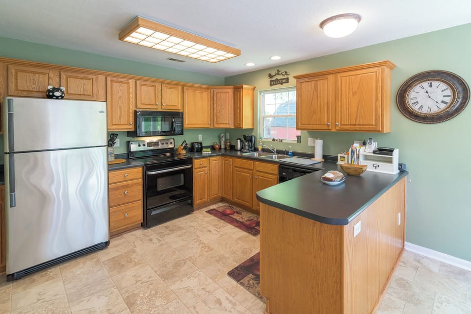 Kitchen includes full-size appliances and island seating—ready for easy meal prep.