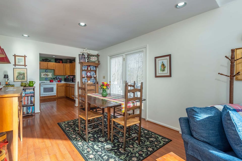 Dining area with seating for 4 & deck access.
