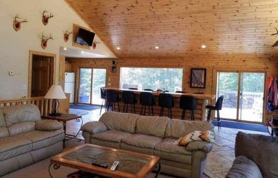 View from Living Room to the Kitchen and 12 Seat Bar!