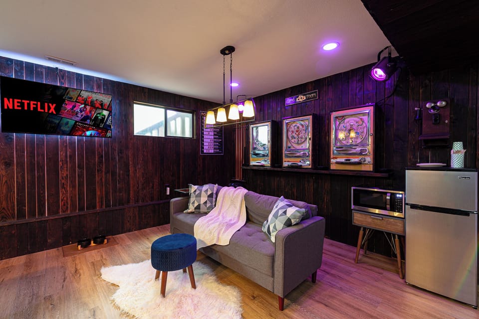 Living area with fridge, microwave... and pachinko machines!