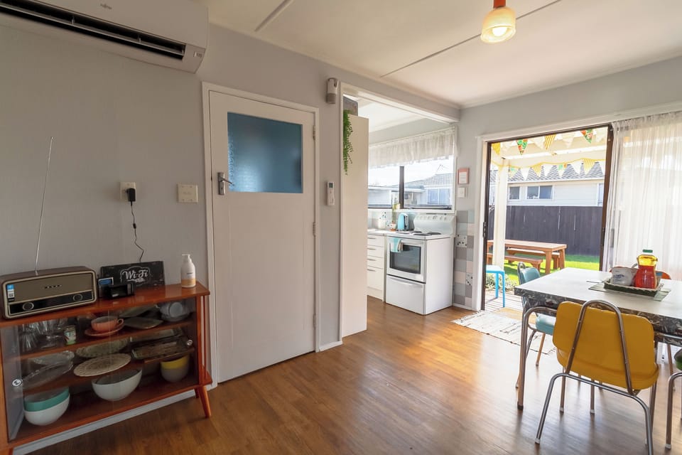 Dining and kitchen area - laundry through door 