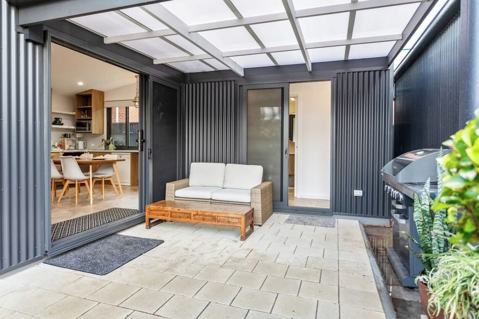 A large undercover patio- perfect for drying laundry or enjoying a hot drink while admiring the garden and bees.