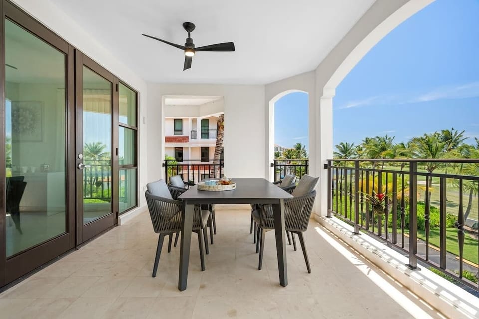 Relax on your private balcony with plush seating and a stylish table, and enjoy stunning views of lush greenery and sparkling water. It’s the perfect spot to unwind and soak in the beauty.






